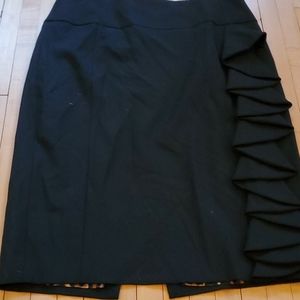 Black pencil skirt with side ruffle.